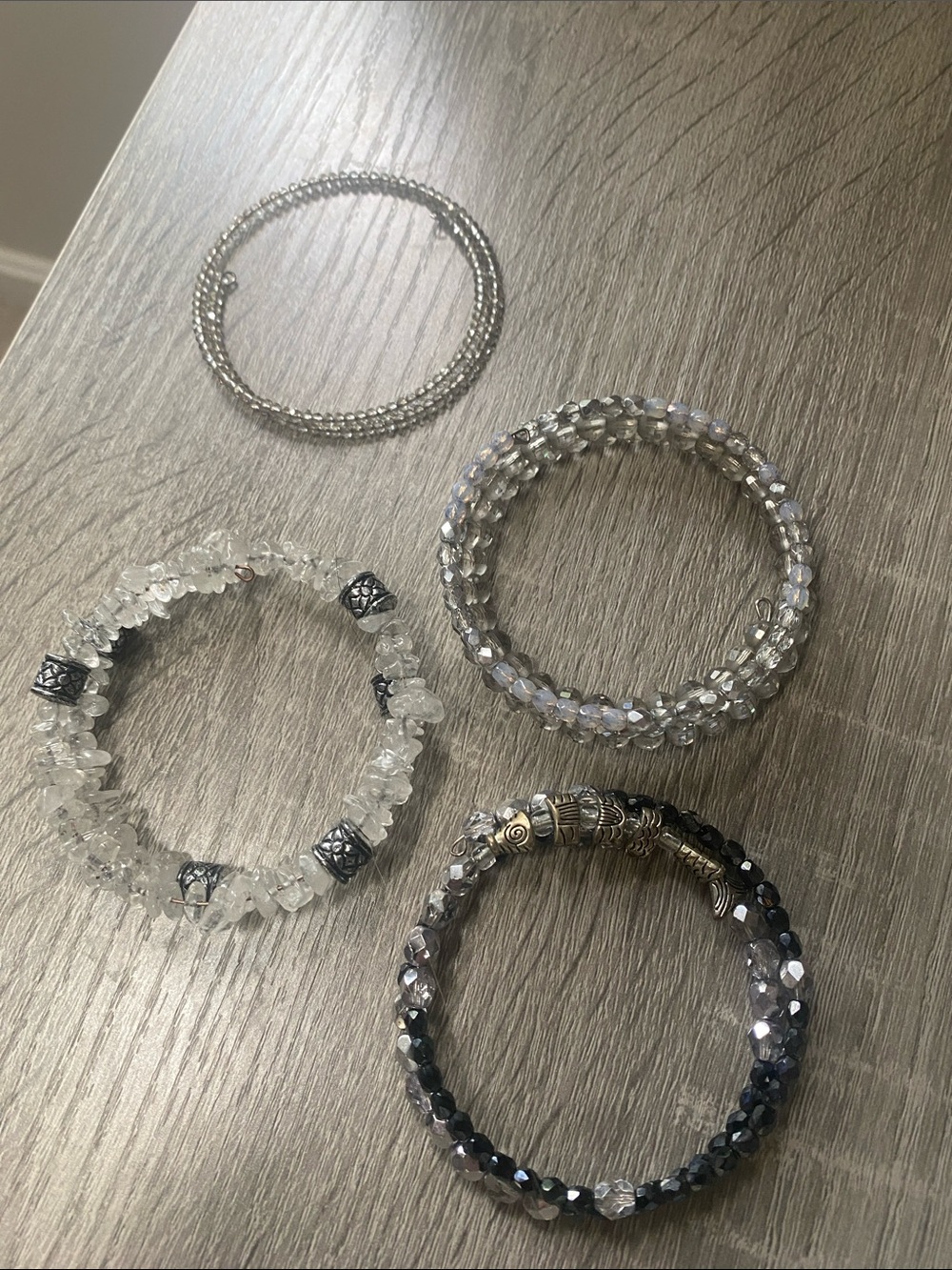 Beadlovers”Clear and Silver, blues and gold Stretch Bracelets”- Set of 6